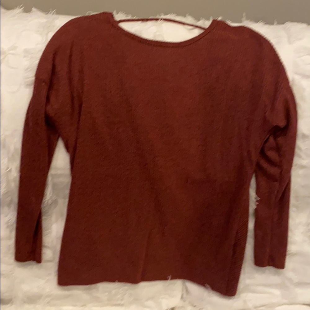 Buckle maroon blouse.